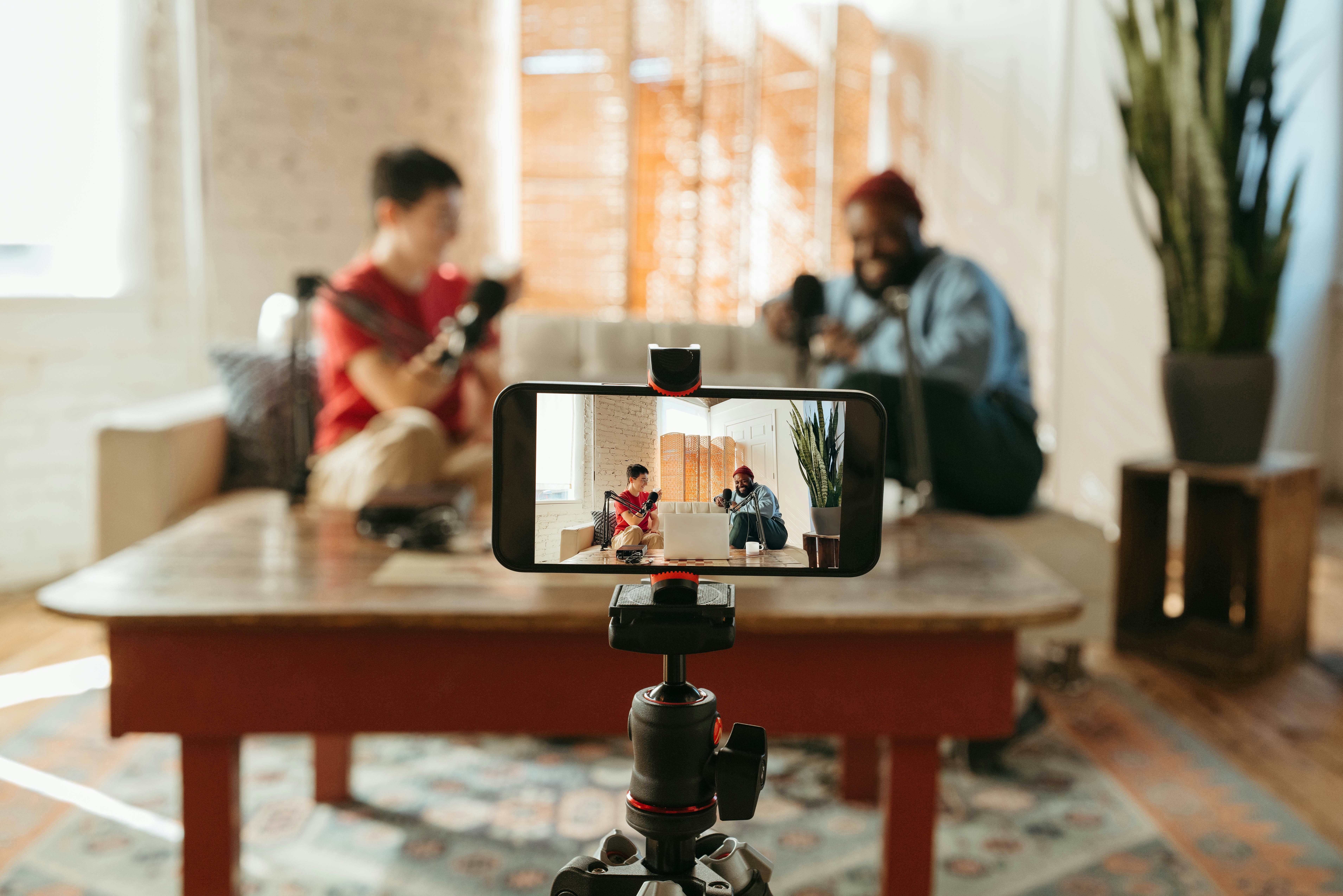 Two creators recording a podcast together